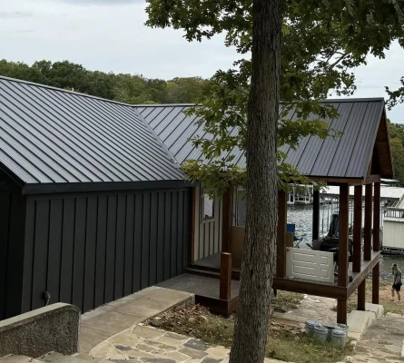 house by water with metal roof