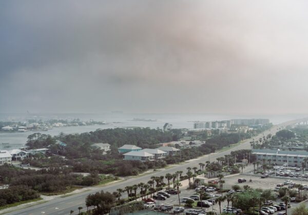 a view of a parking lot and a body of water